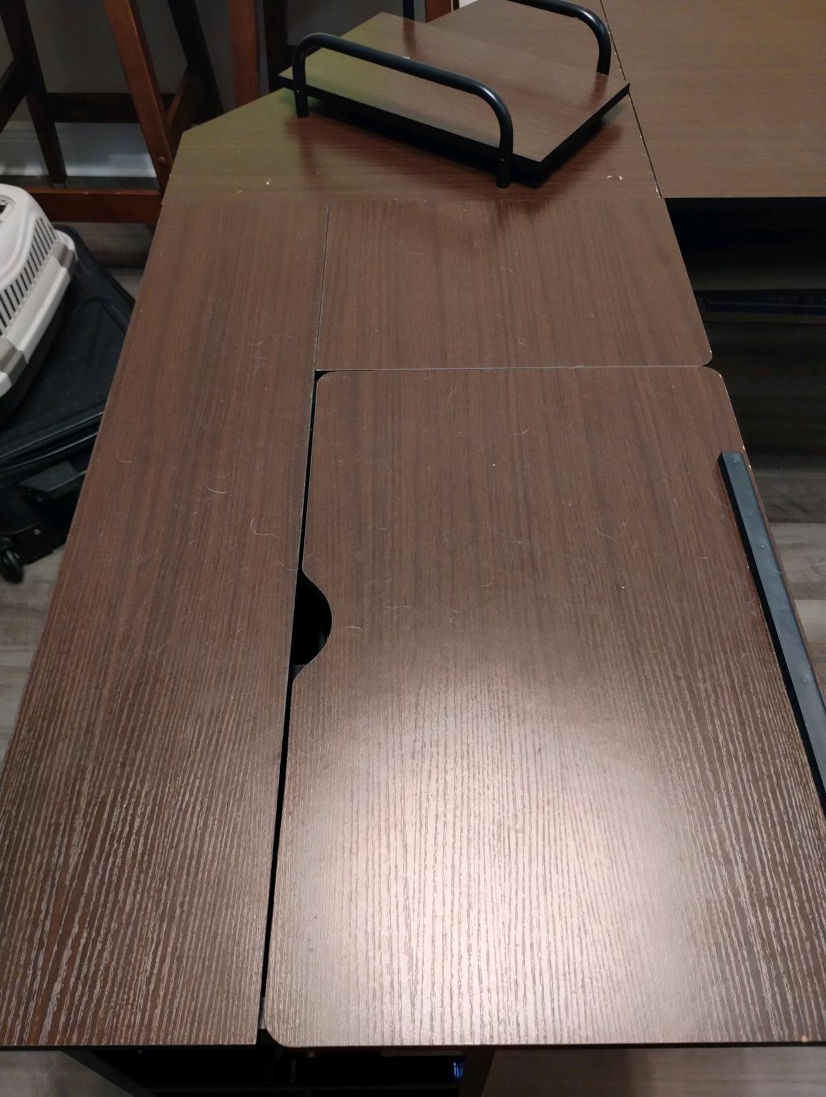 Lshaped desk with adjustable drafting section and shelves