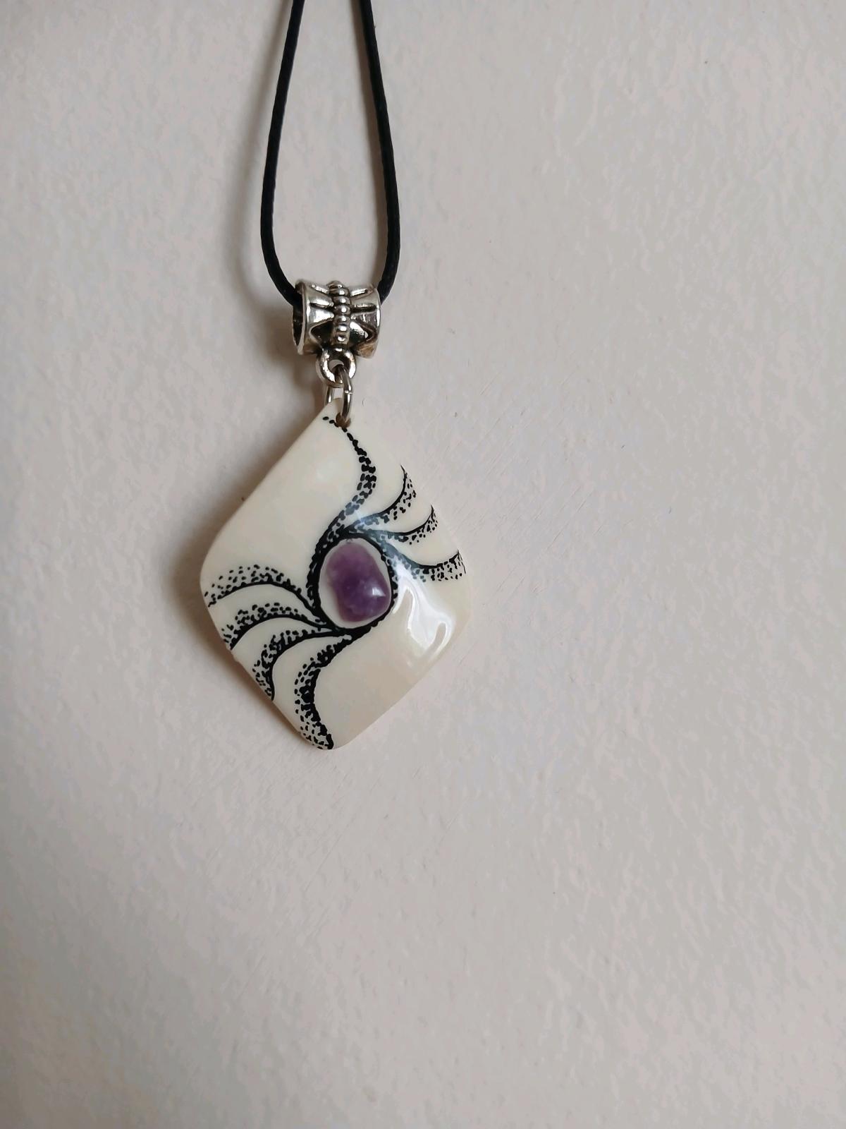 mammoth tusk pendant with natural amethyst