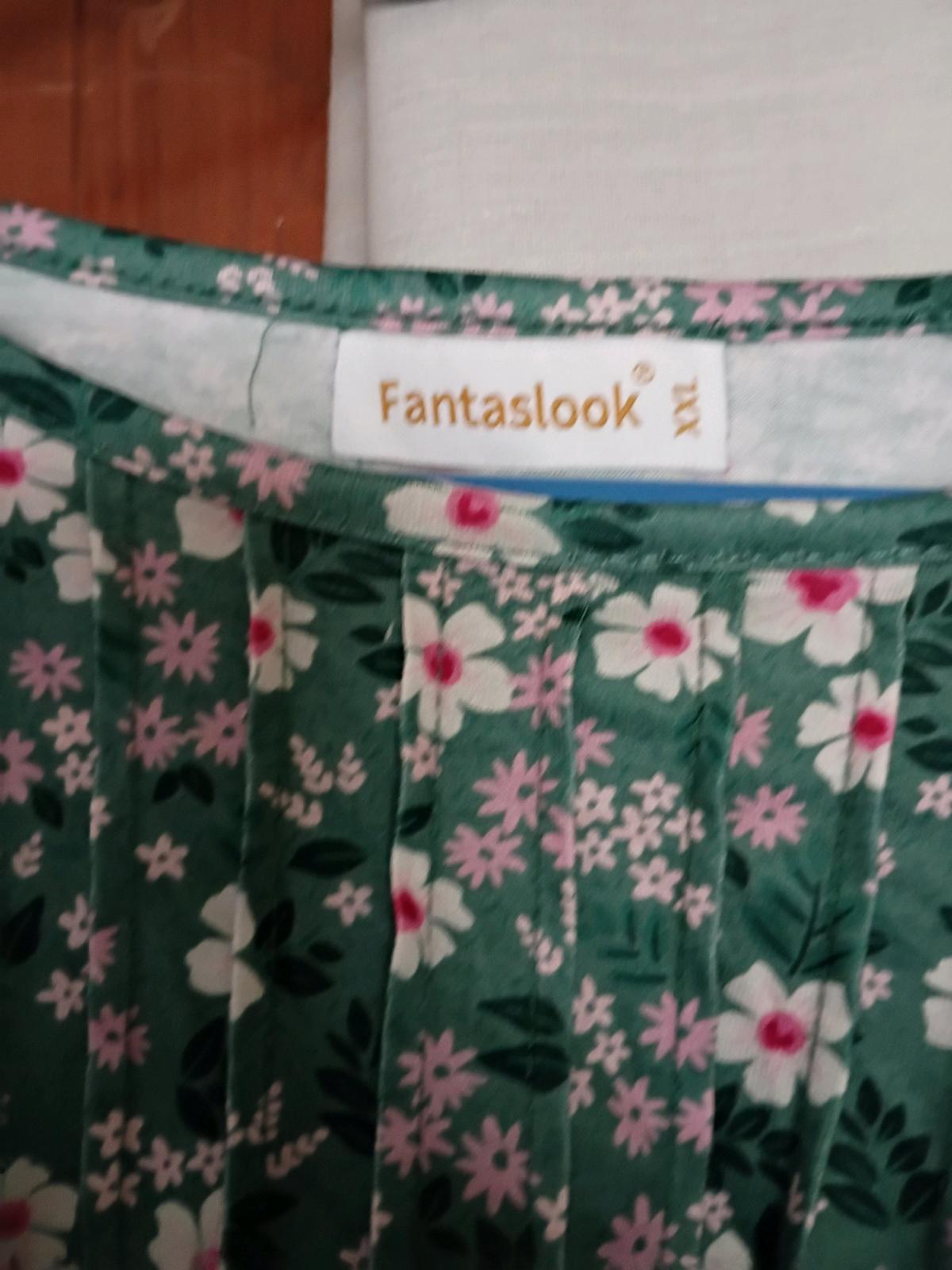 a beautiful floral blouse again I never wore designer fantas