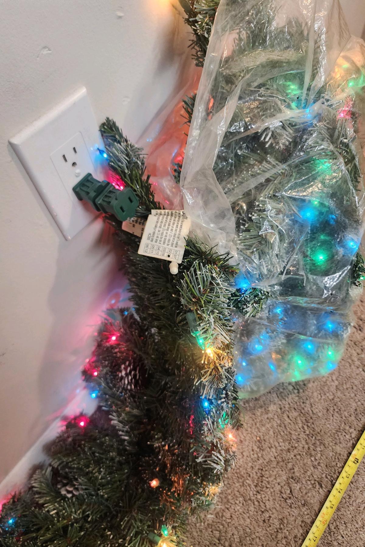 Realistic 9ft flocked garland w multi lights and pinecones
