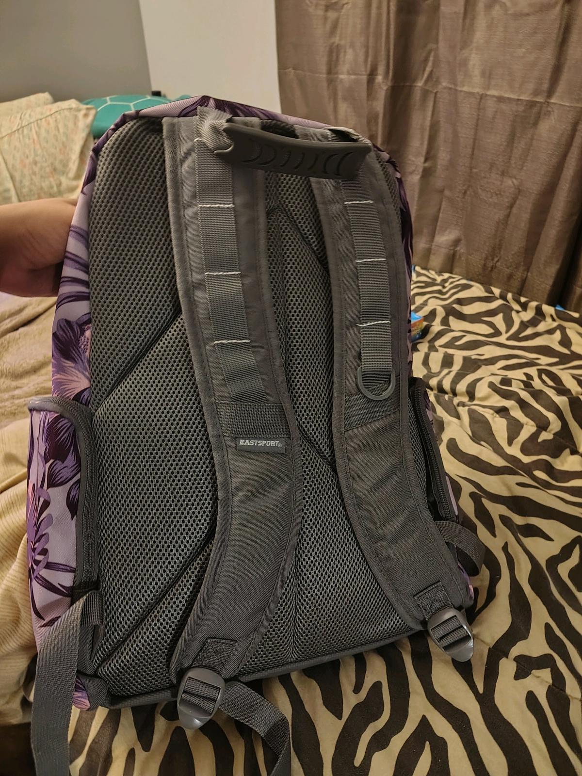 black rolling backpack and a purple non rolling backpack