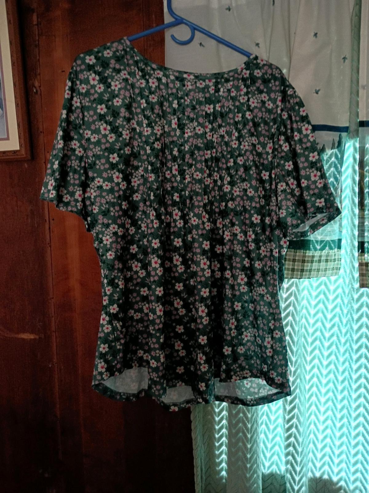 a beautiful floral blouse again I never wore designer fantas
