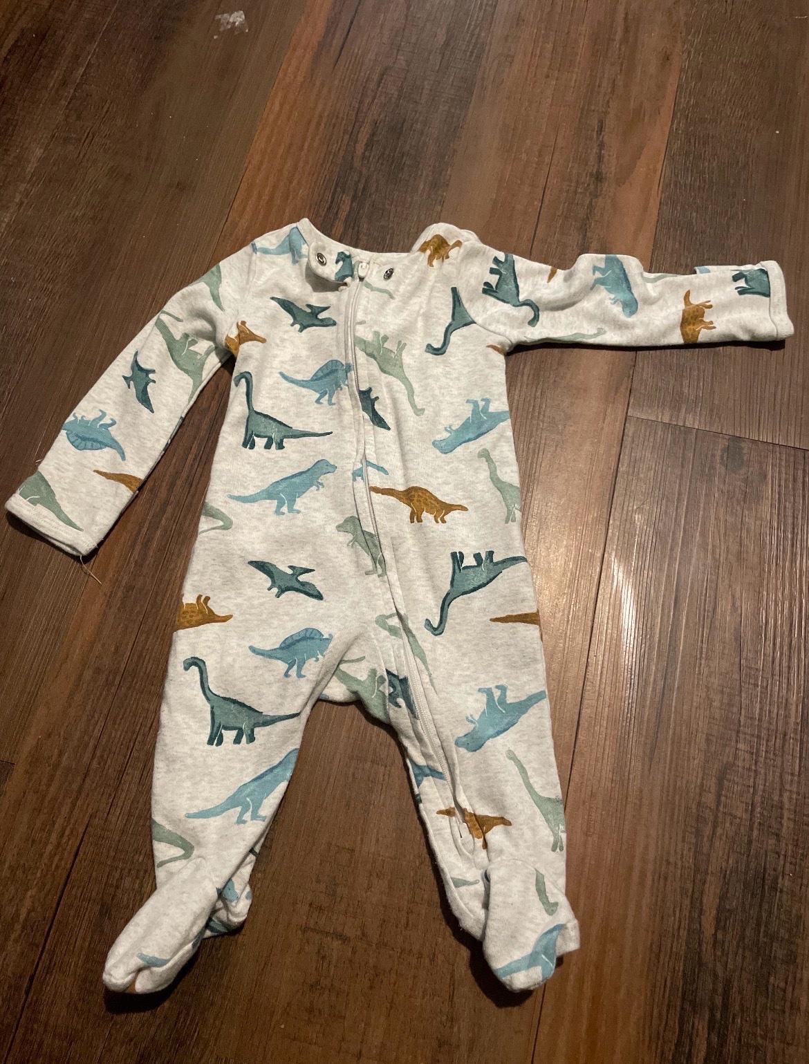 ten baby sleepers ranging in sizes 0 to 3 months