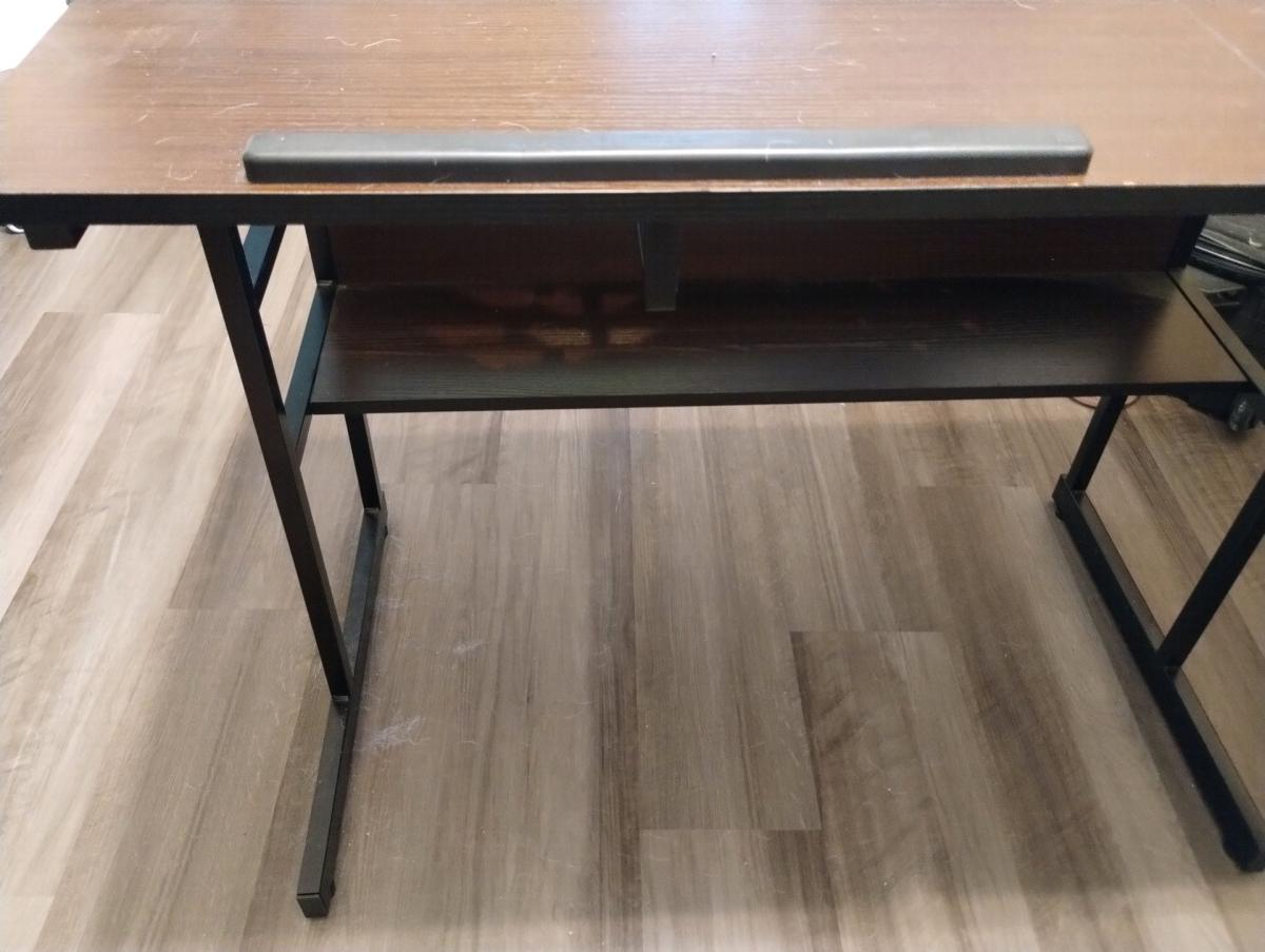 Lshaped desk with adjustable drafting section and shelves