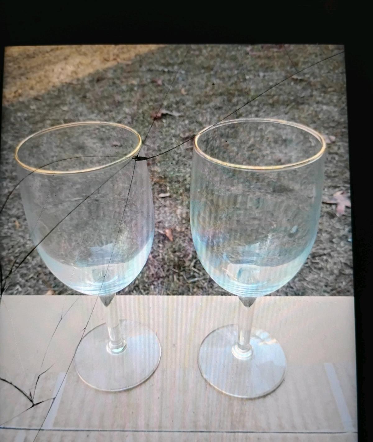 A Set of Two Gold Rimmed Glasses