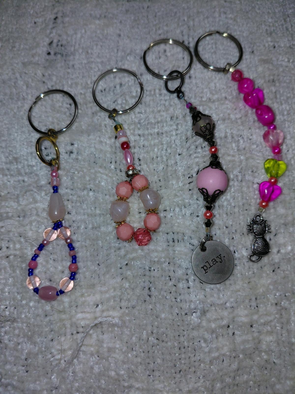 Several key chains zipper pulls and purse accessories