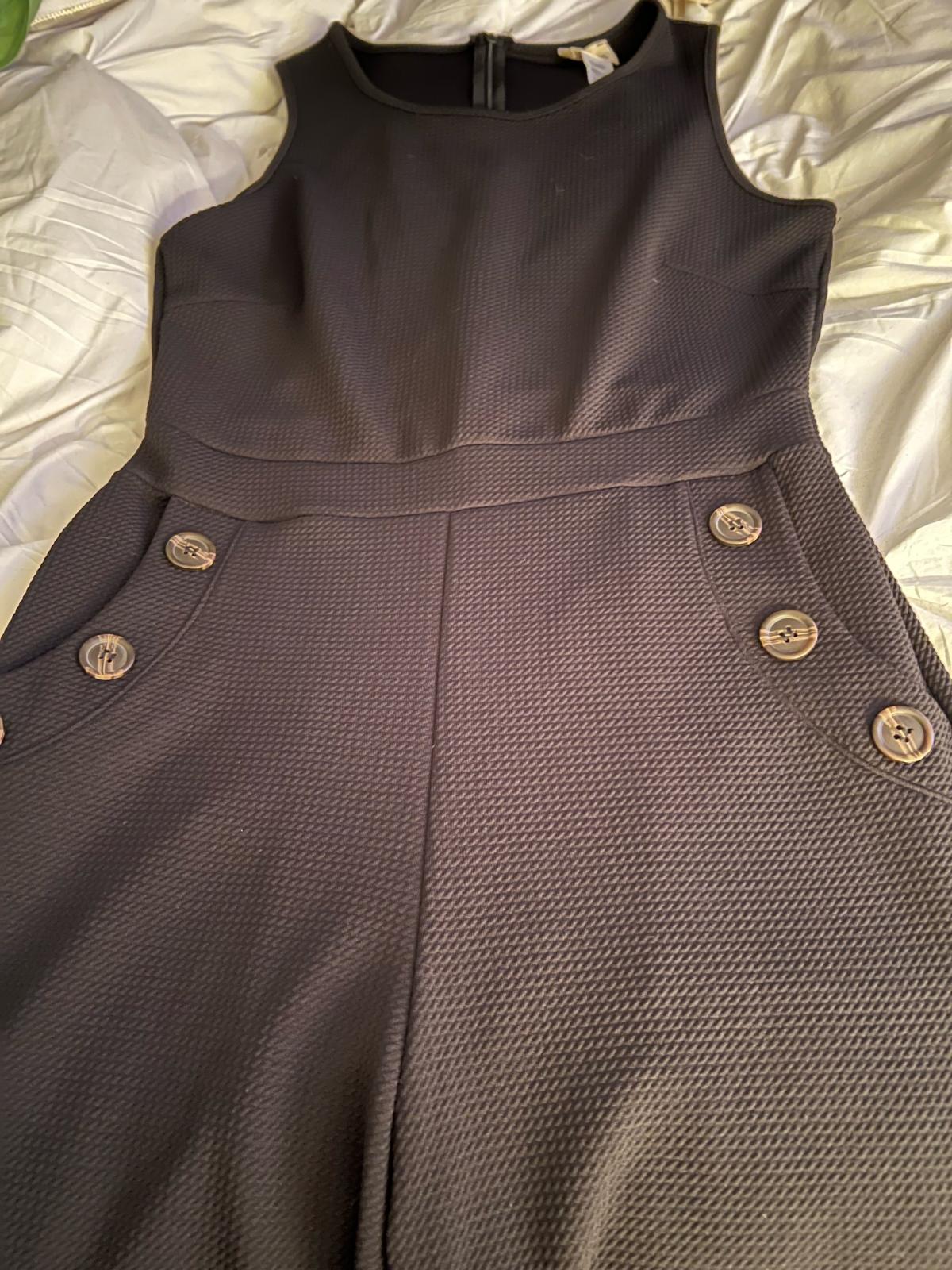 Black one piece jumpsuit with front pockets and buttons lg