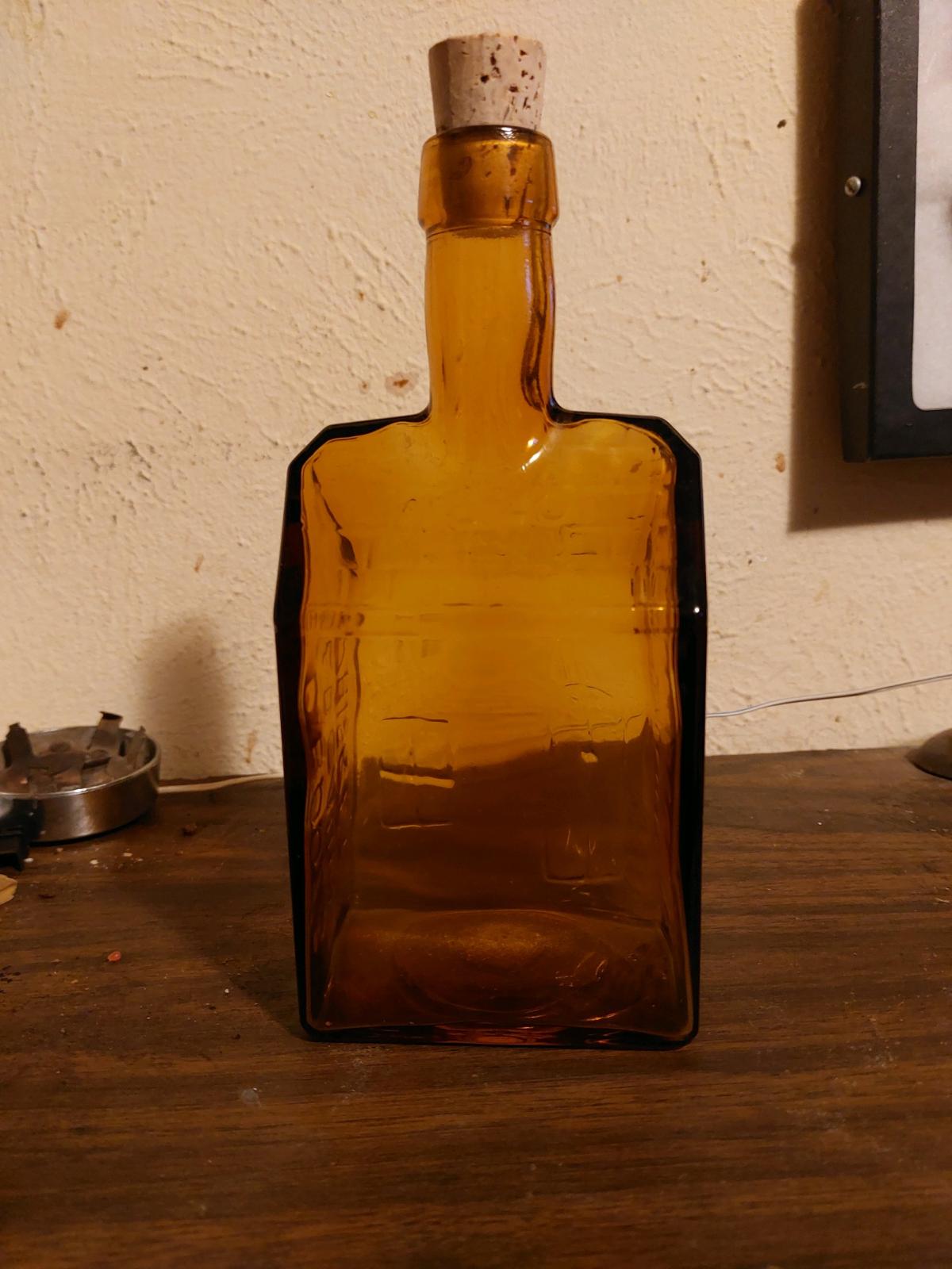 vintage bcboozs old cabin whiskey amber bottle