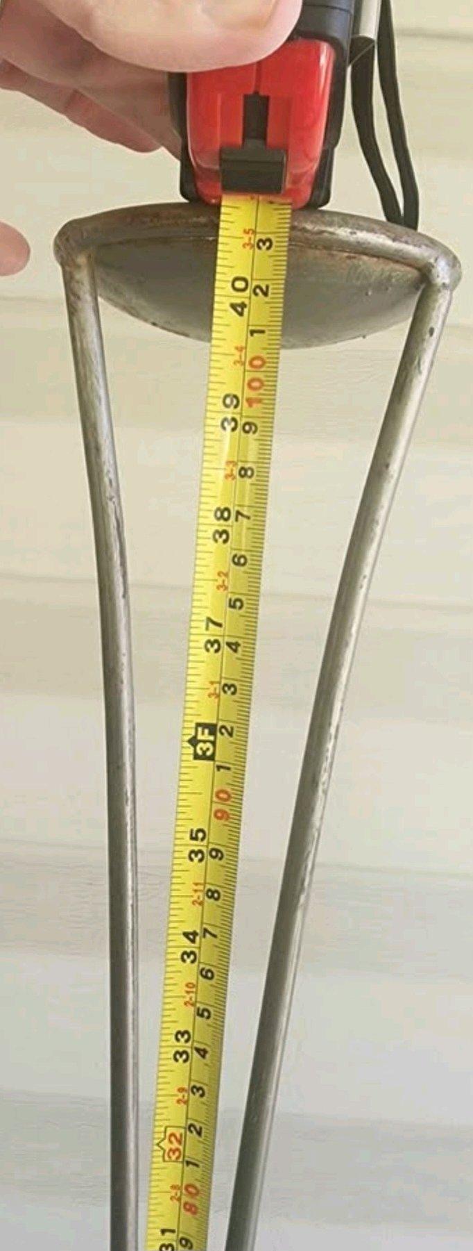 Tall slender metal candle stand
