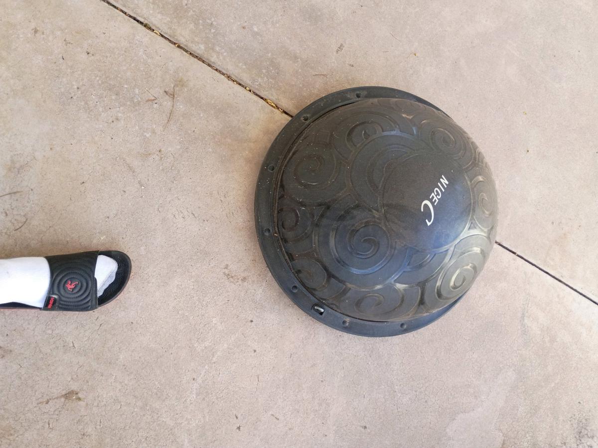 three punching bags and a yoga ball and a yoga ball