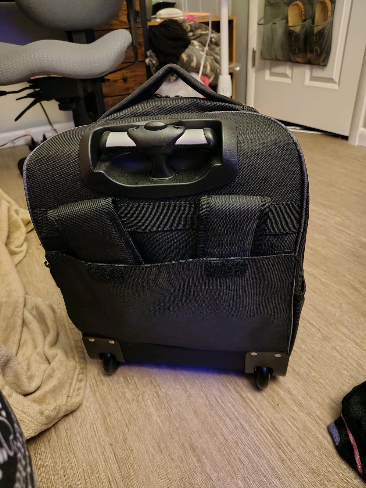 black rolling backpack and a purple non rolling backpack