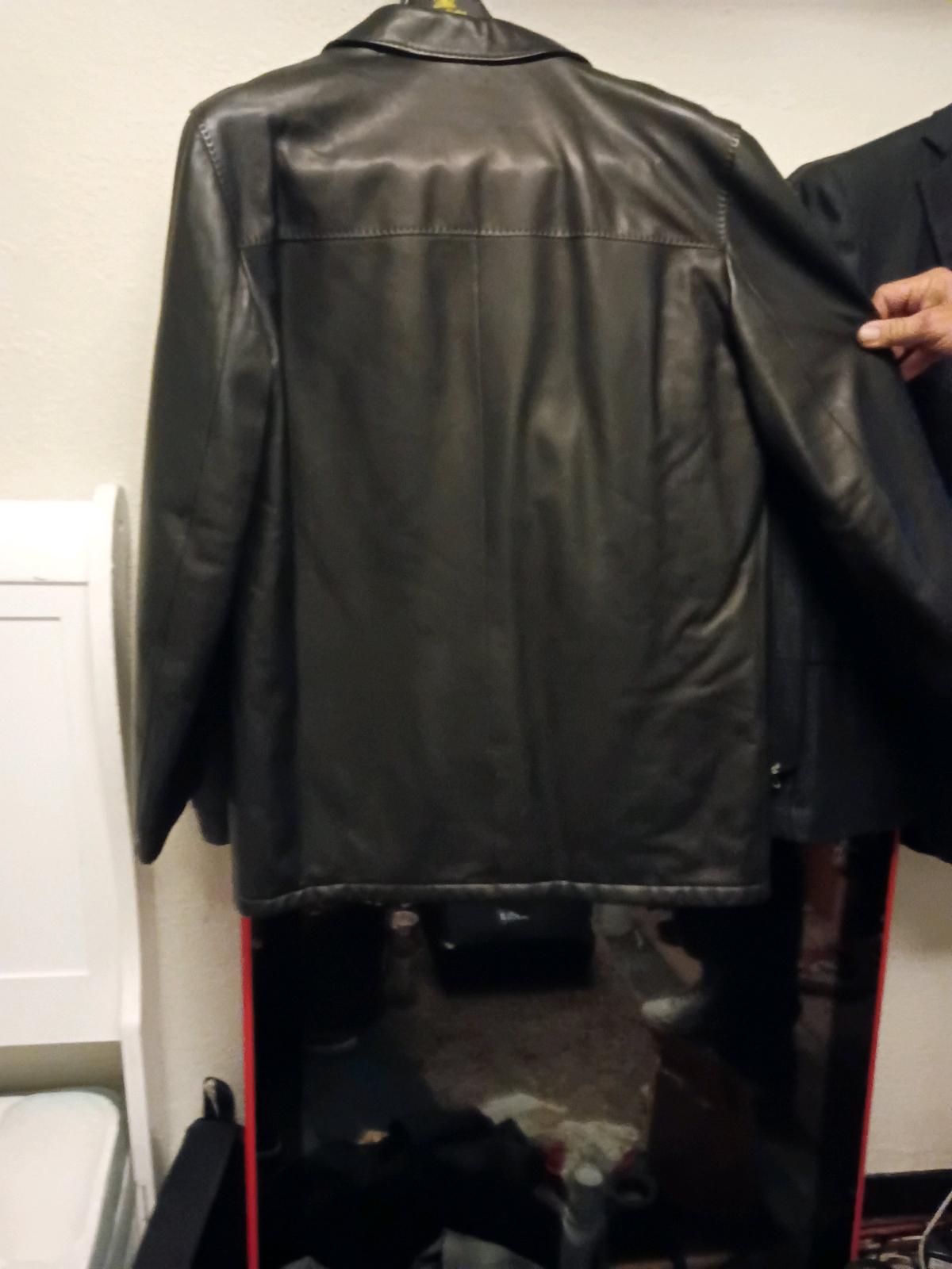 Sleek Kiton leather trench for men Smooth finish with minima
