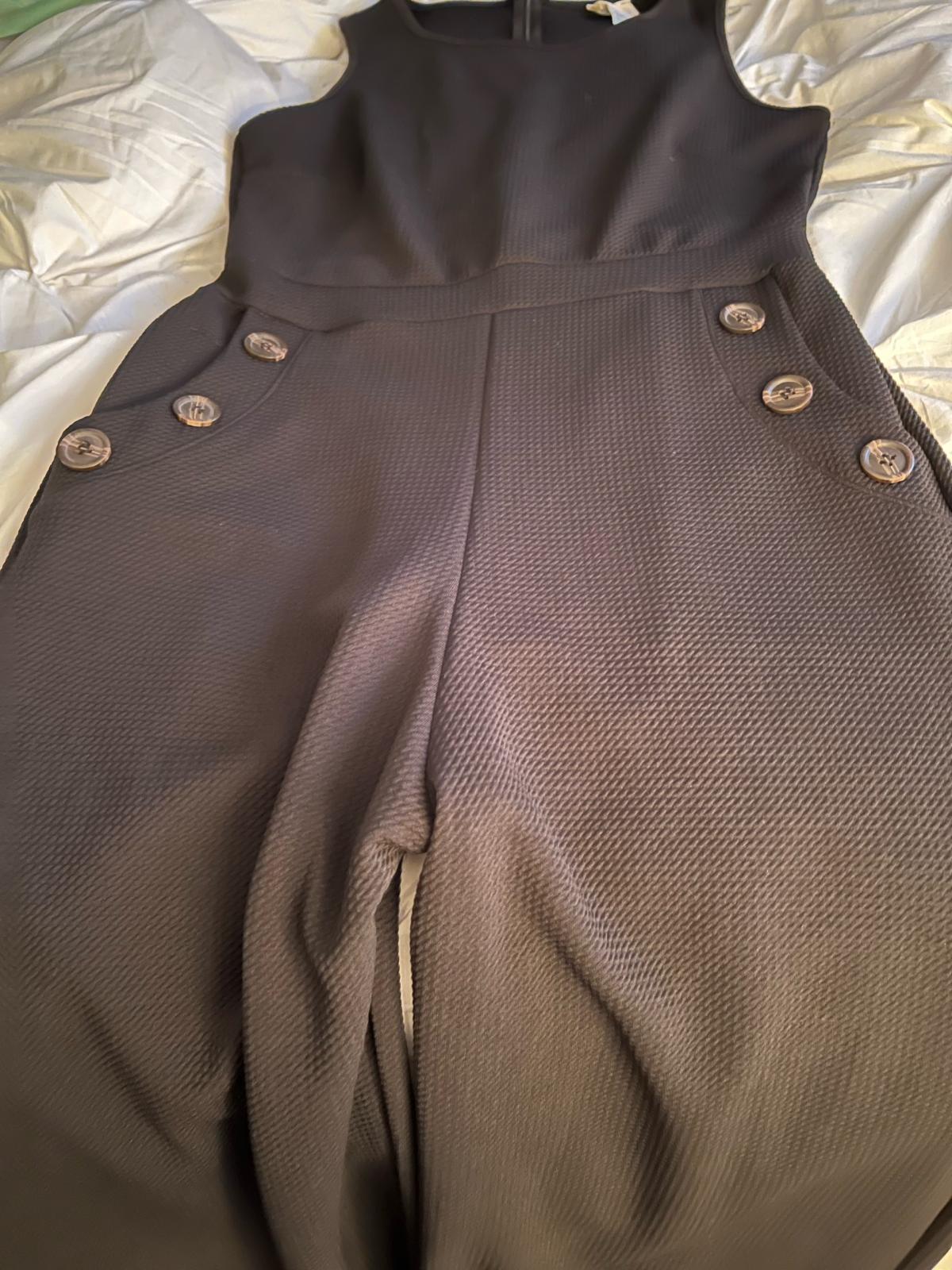 Black one piece jumpsuit with front pockets and buttons lg