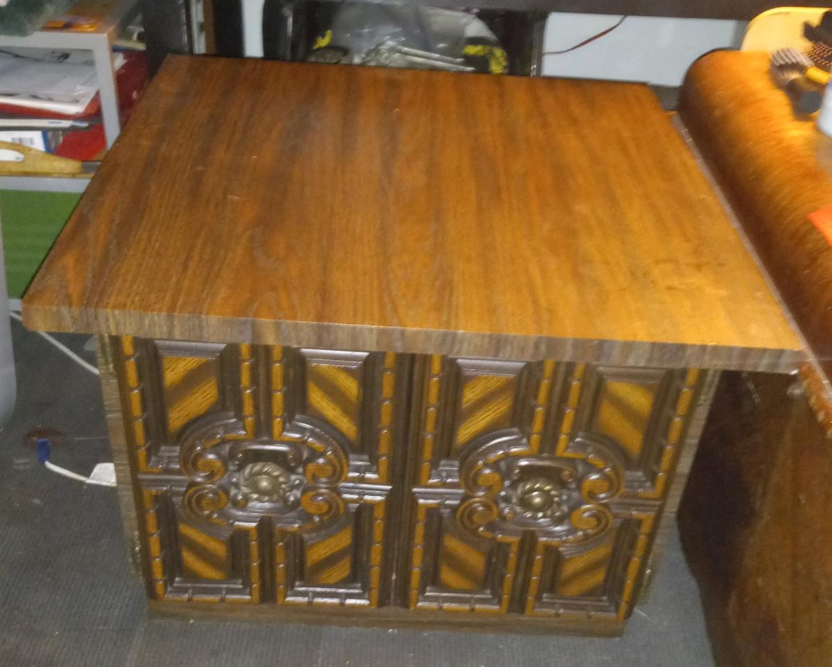 Vintage brown wood cabinet with 2 hinged carved wood doors