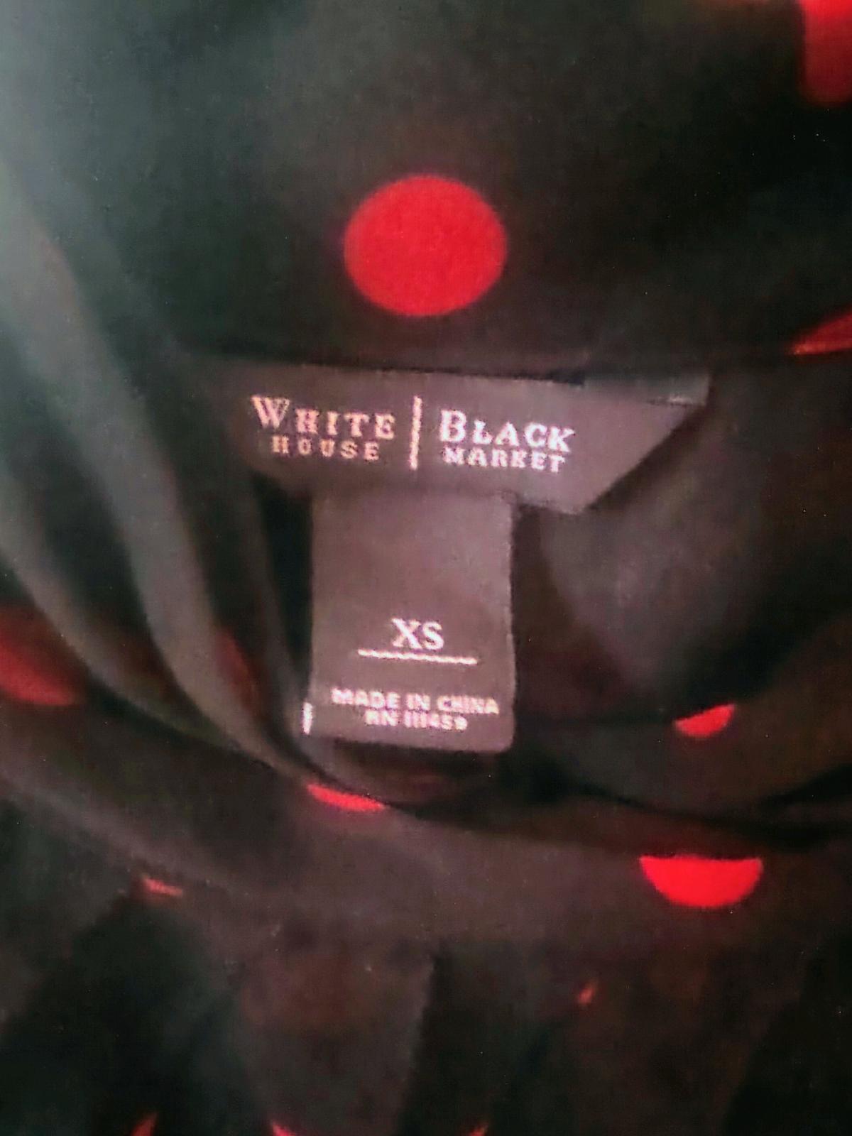 Black blouse with red pocka dots