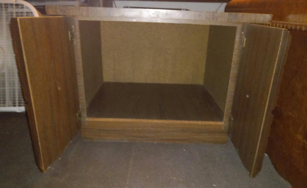 Vintage brown wood cabinet with 2 hinged carved wood doors