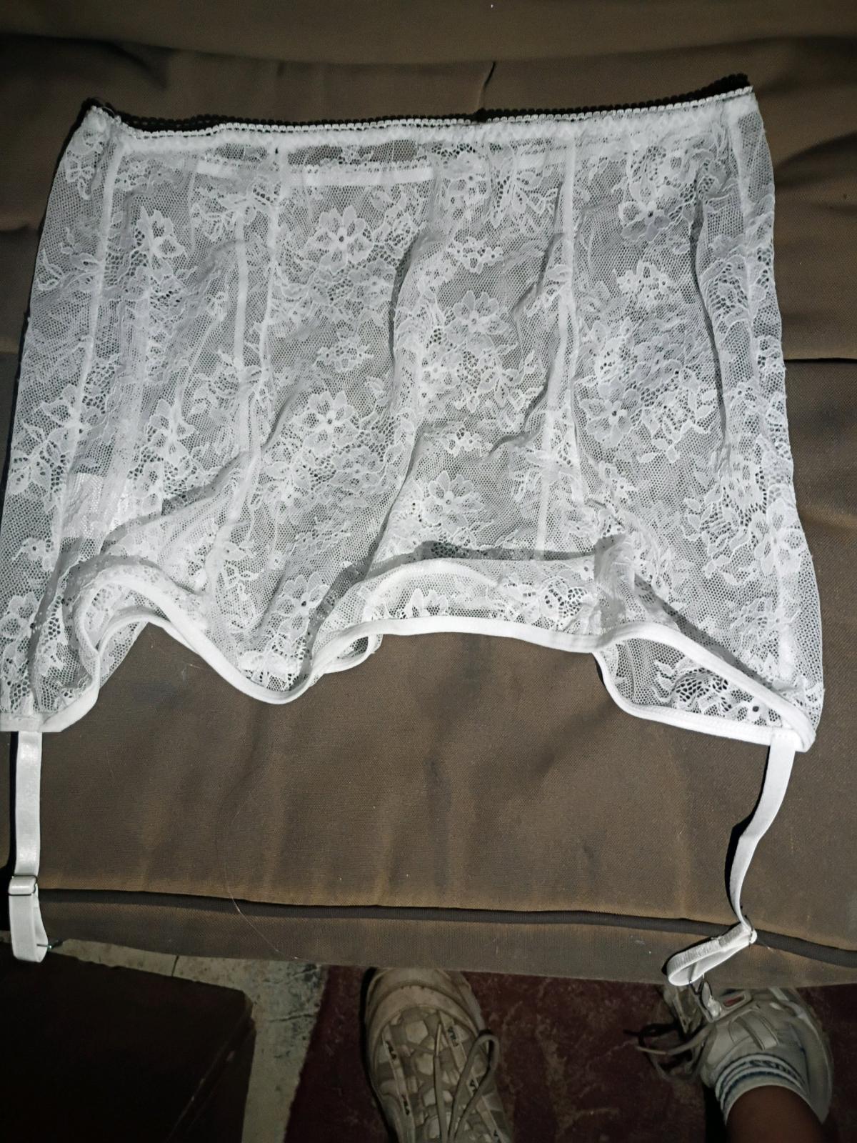 A Sexy Womans White Sheer Top with Panties and Matching Skir