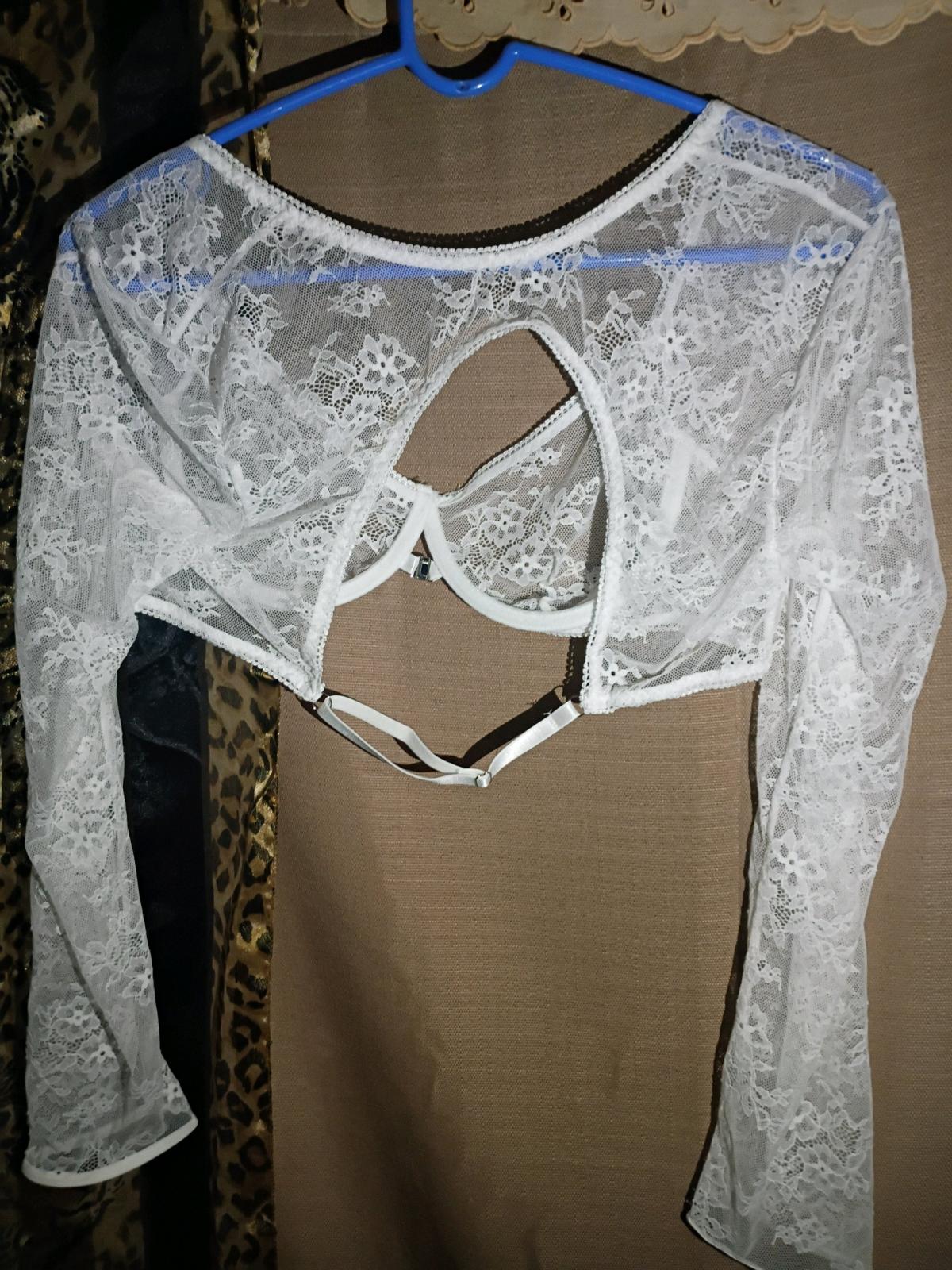 A Sexy Womans White Sheer Top with Panties and Matching Skir