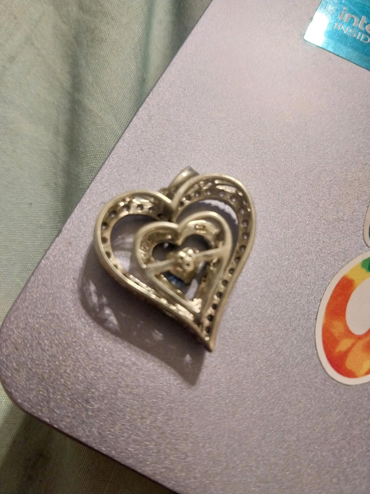 Silver Heart Pendant with an infinity sapphire stone