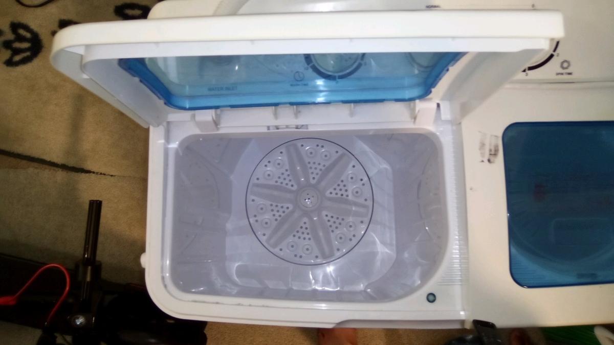 used small porterable washer with all hookups and cord