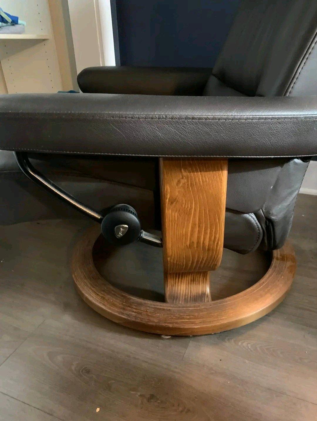 Ekornes brown leather recliner and ottoman