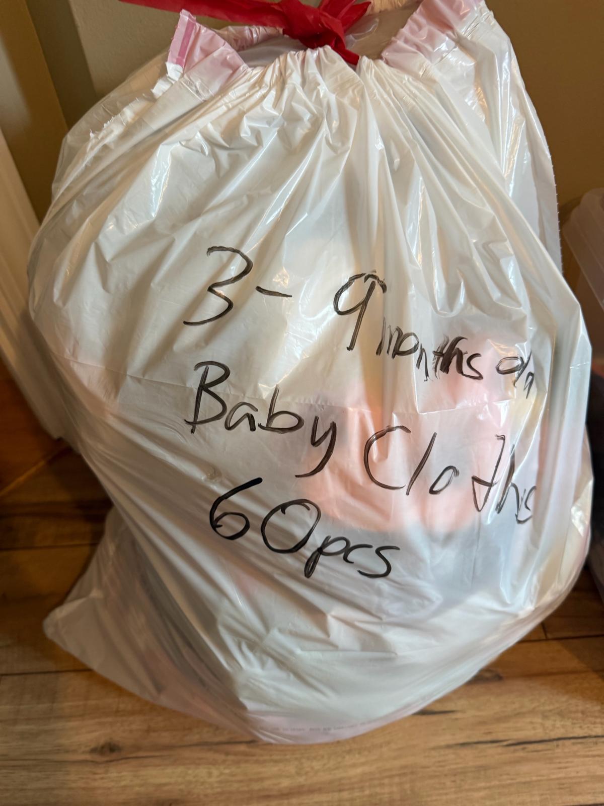 assorted baby girl clothes