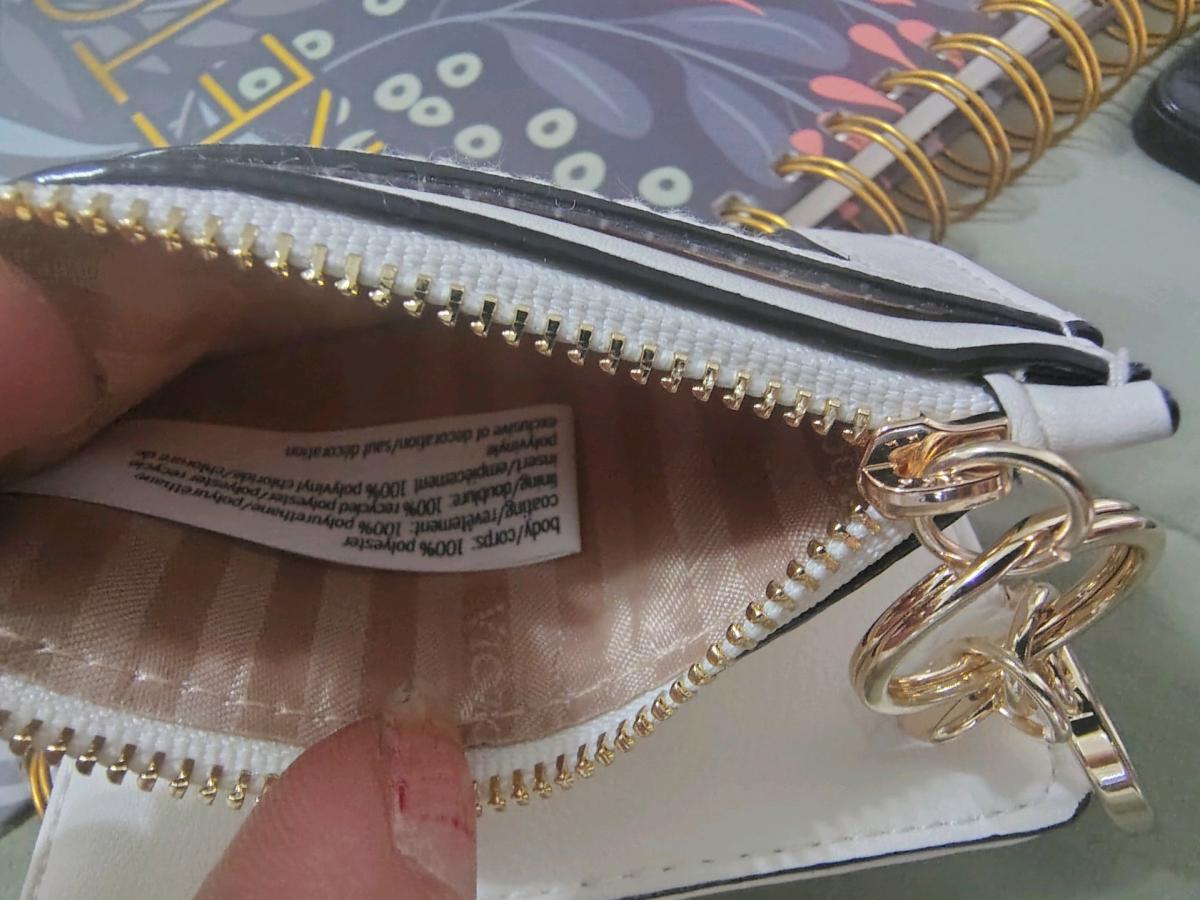 This is a white Victorias Secret foldover card case keychain