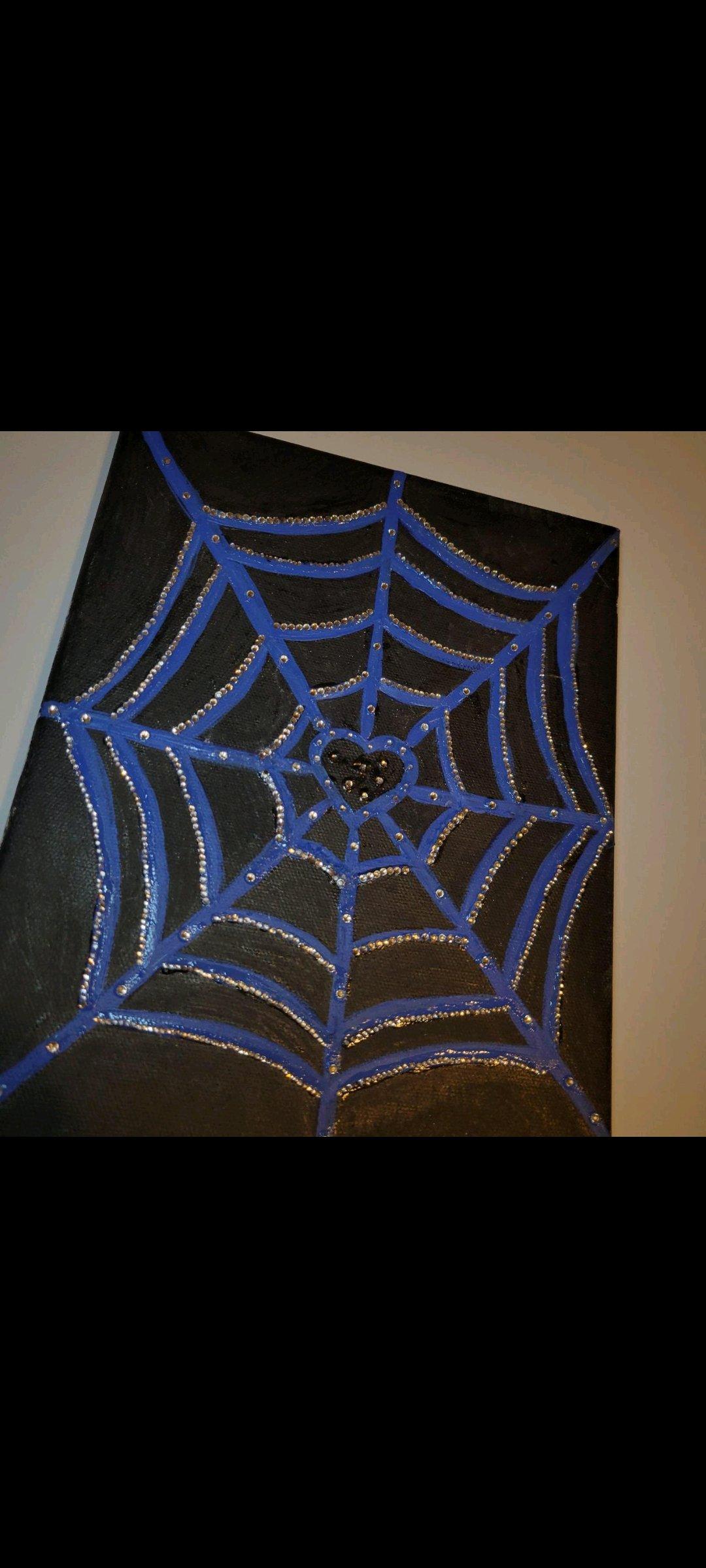 Blue spiderweb with silver rhinestones