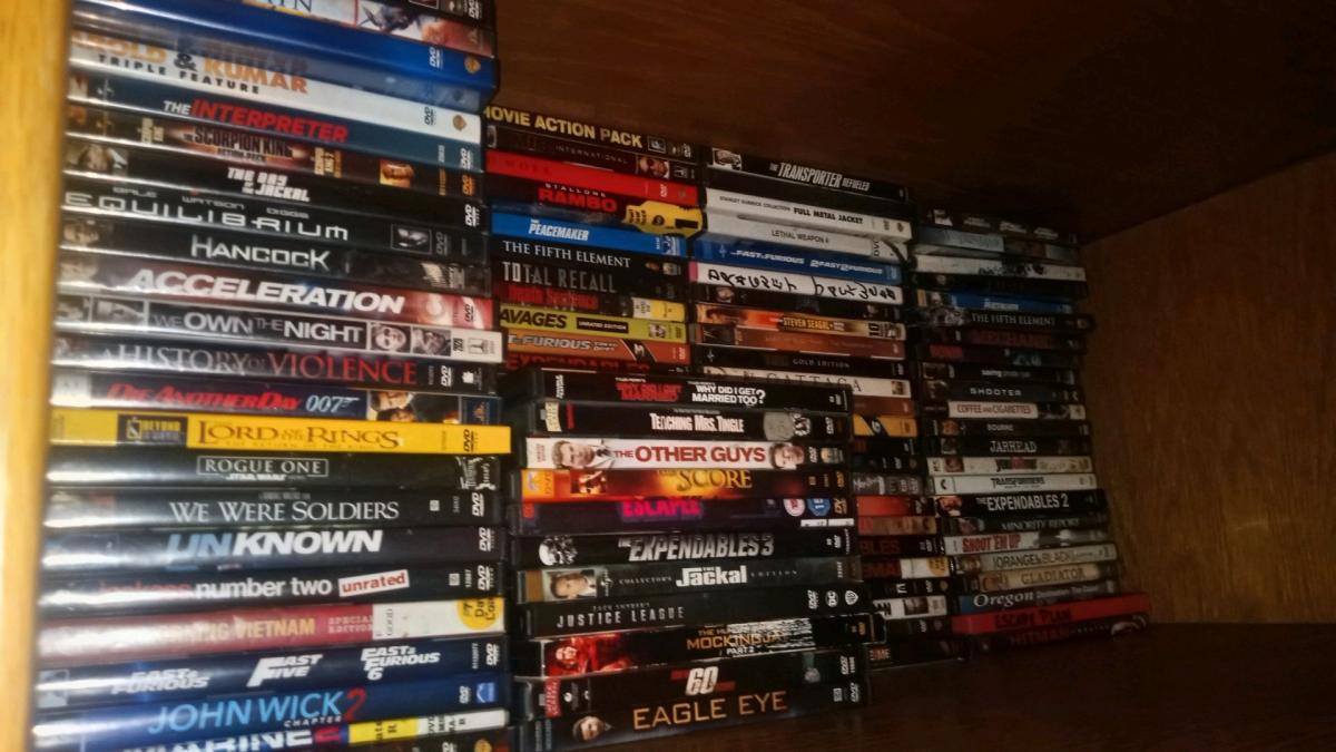 over 100 dvd movies all in case like new