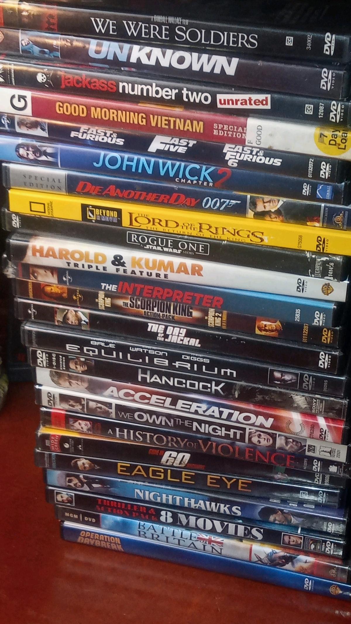 over 100 dvd movies all in case like new