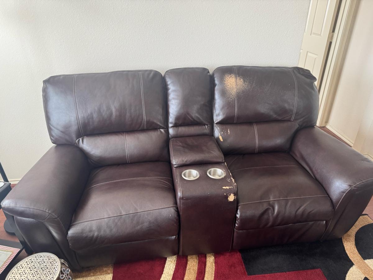 Brown Leather Reclining Loveseat with storage and cup holder