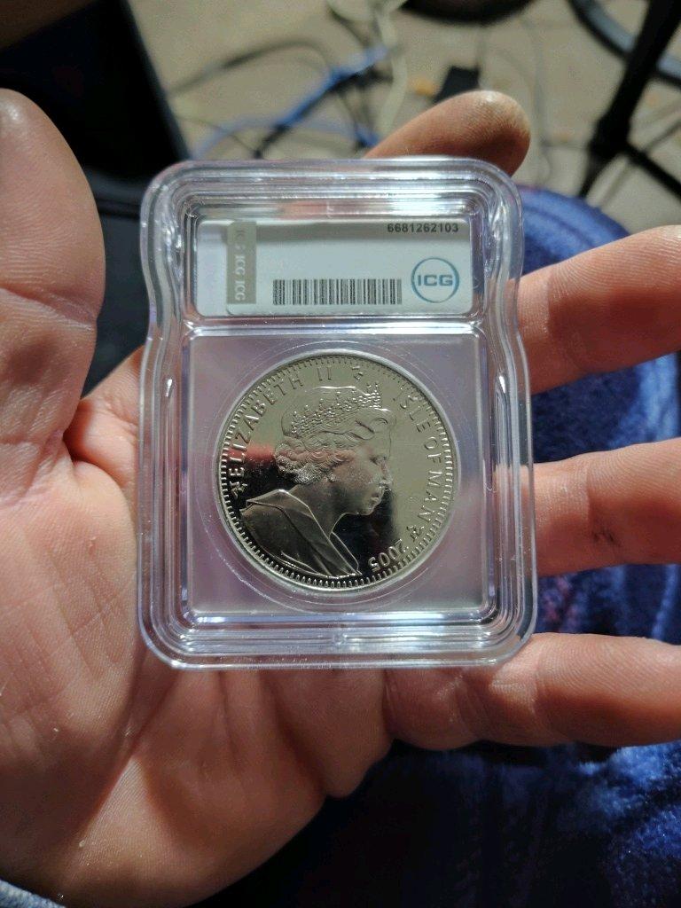 created icg 2005 ms65pl of man crown and two copper rounds