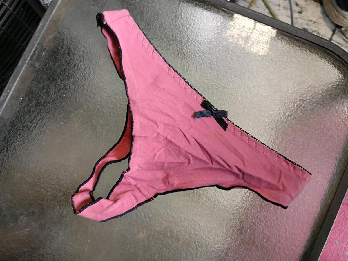 A Sexy Womans New Pair of Pink  and black thong panties