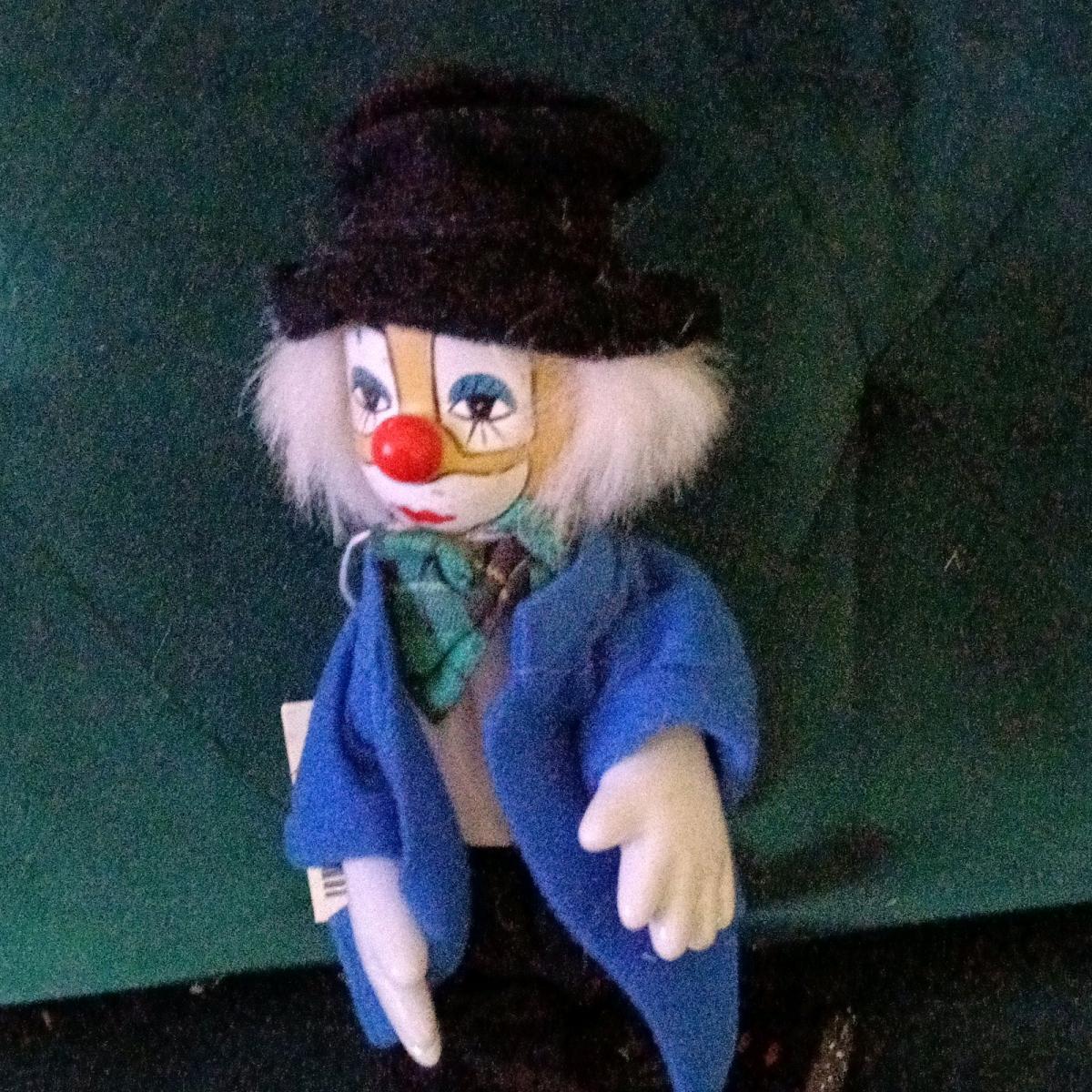 Vintage porcelain clown doll with white painted features