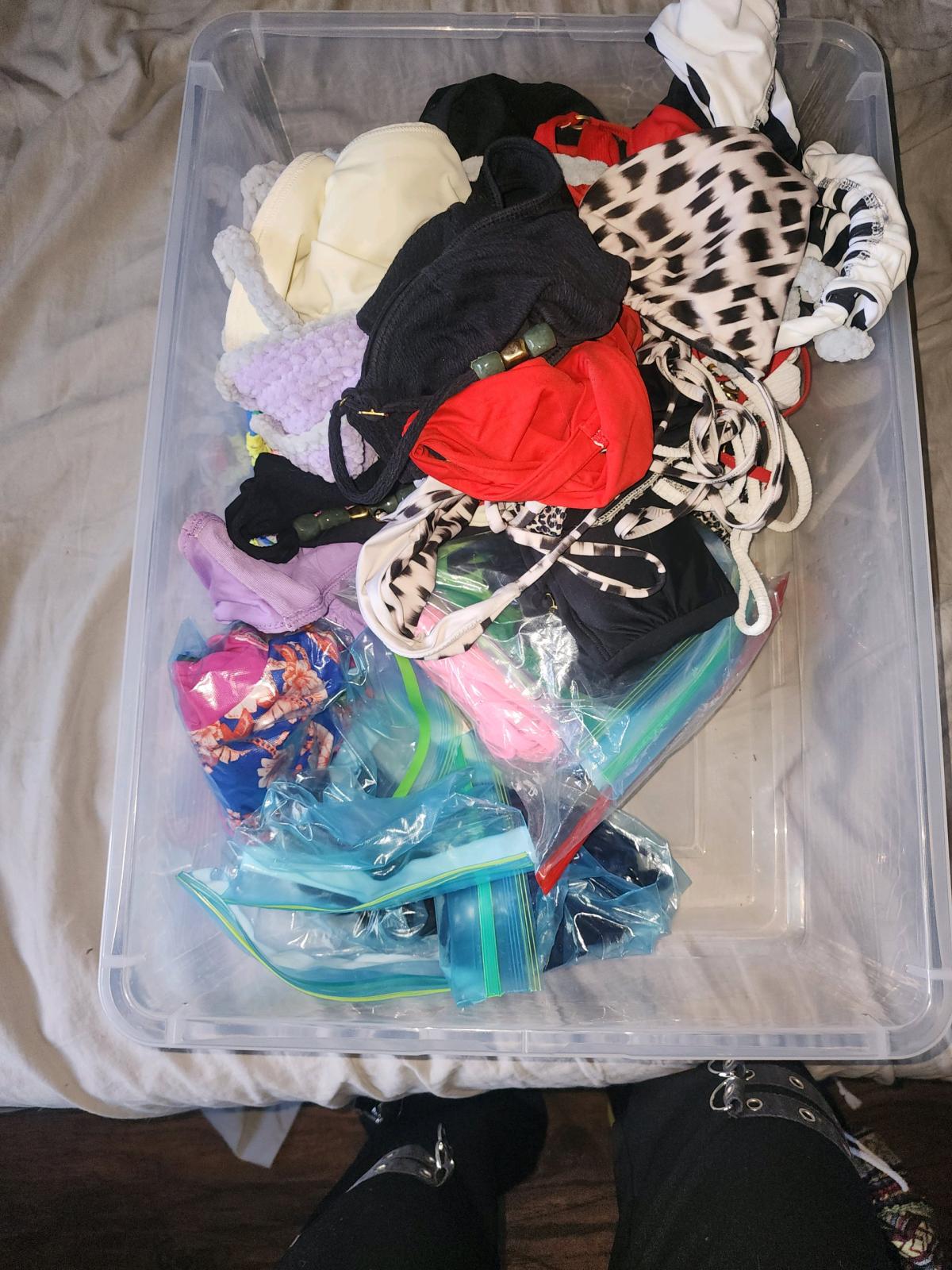 bins of small and medium swim suits