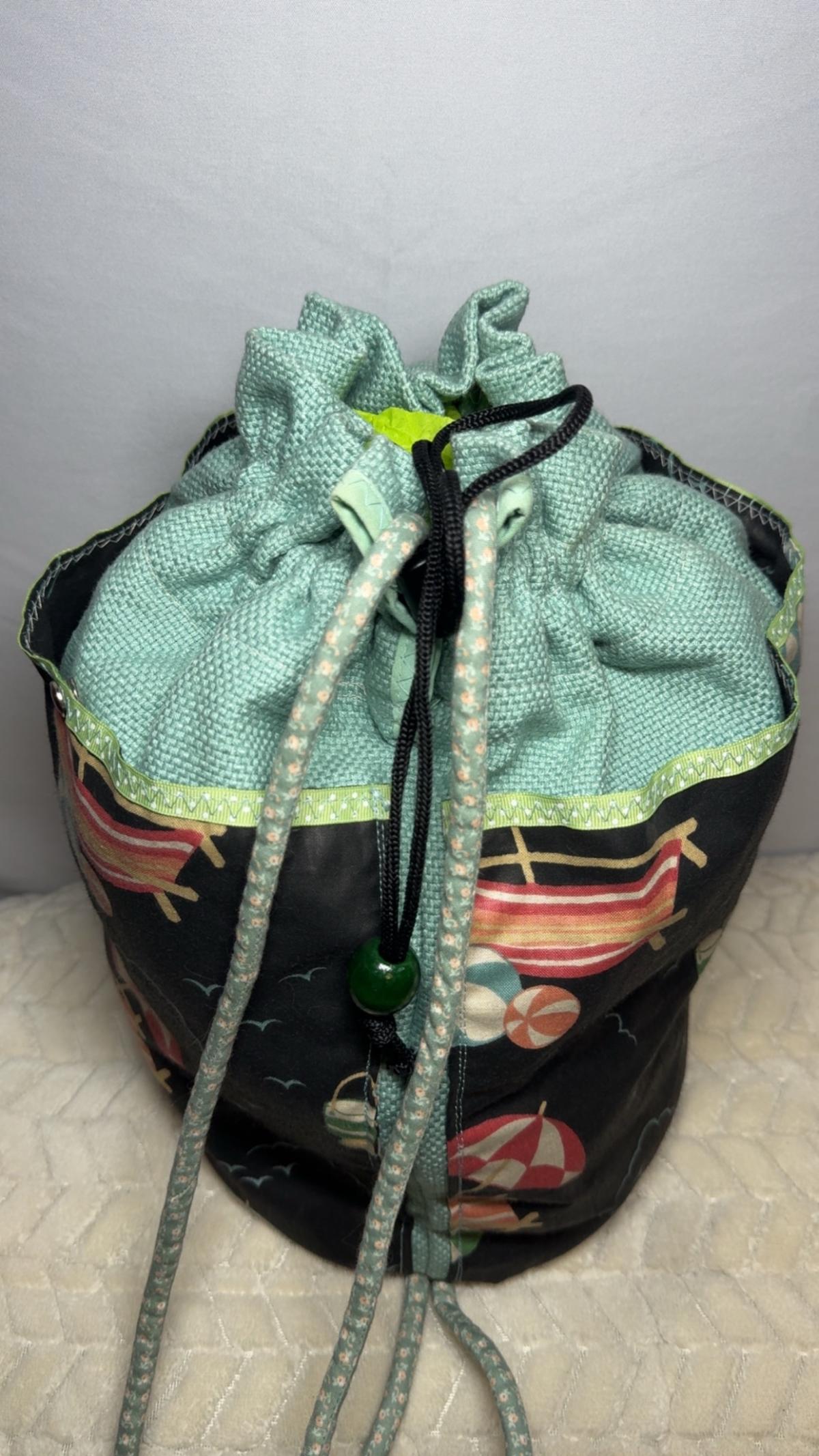 drawstring beach print bucket bag in mint and black