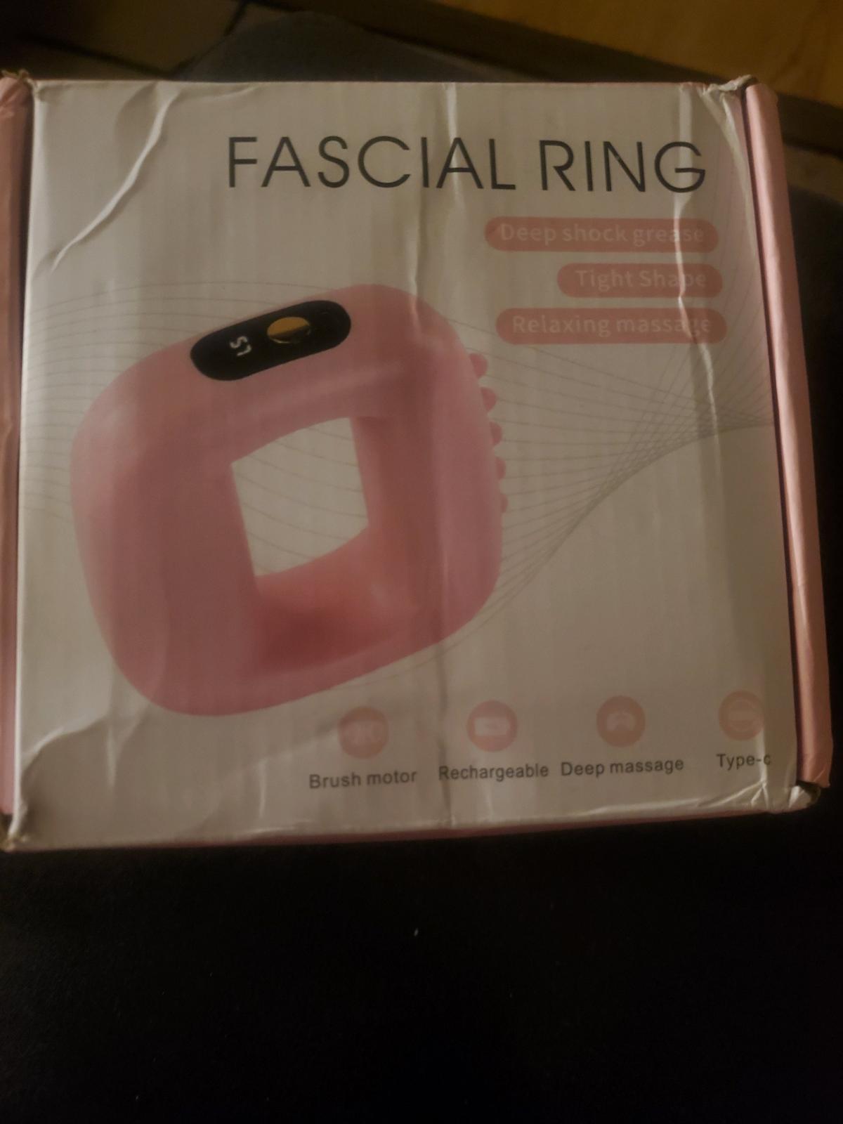 Pink fascial ring massager with strap and charger