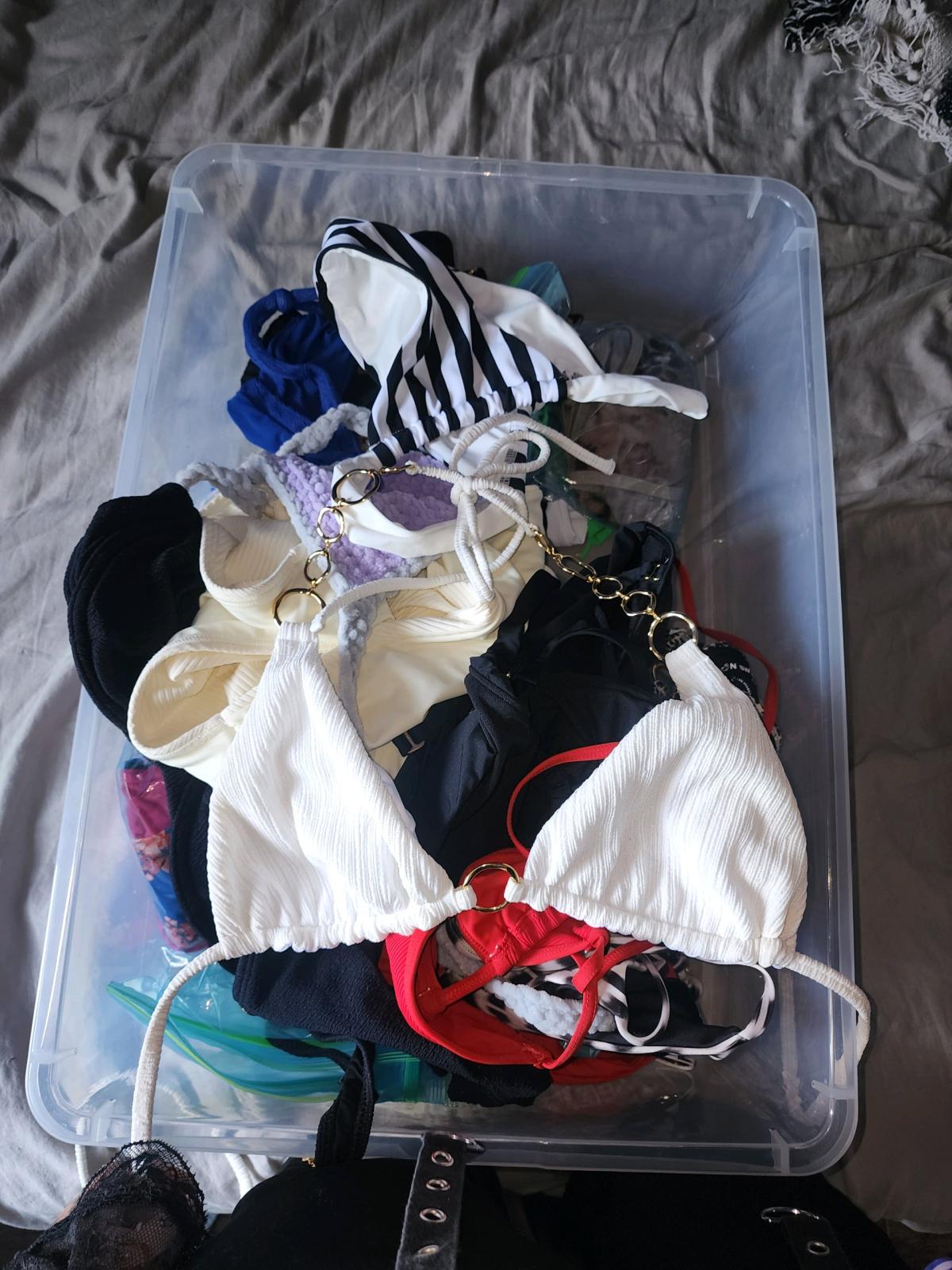 bins of small and medium swim suits