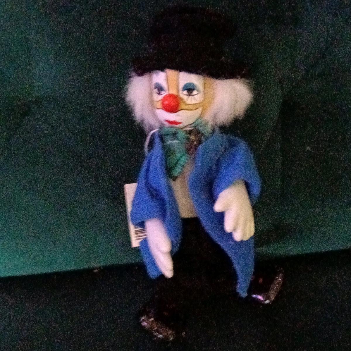 Vintage porcelain clown doll with white painted features