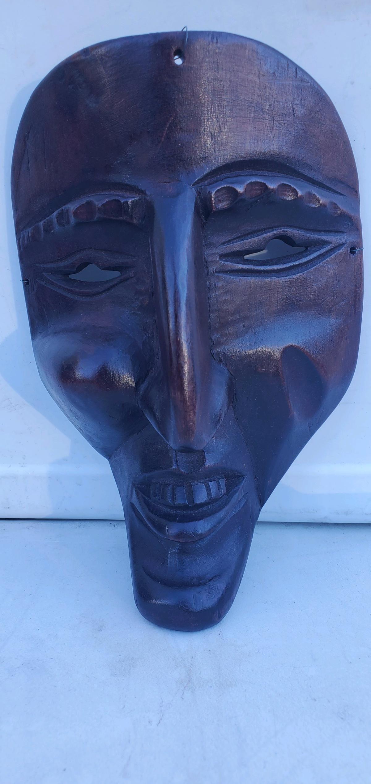 This is a  handcarved dark wood tribal or folk art