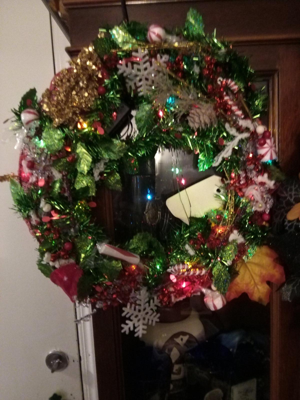 wreath for holidays with lights on it for door