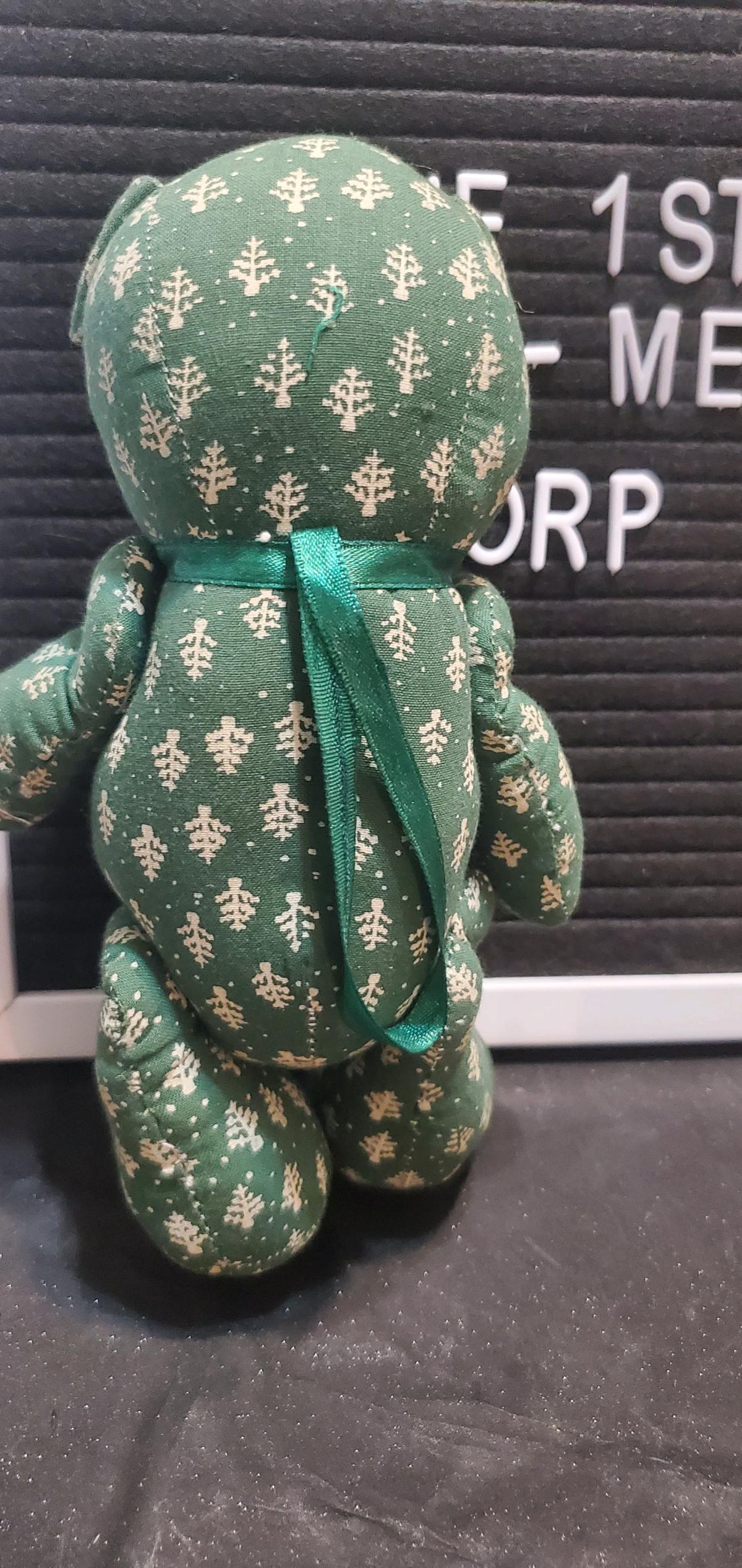 green patterned fabric teddy bear