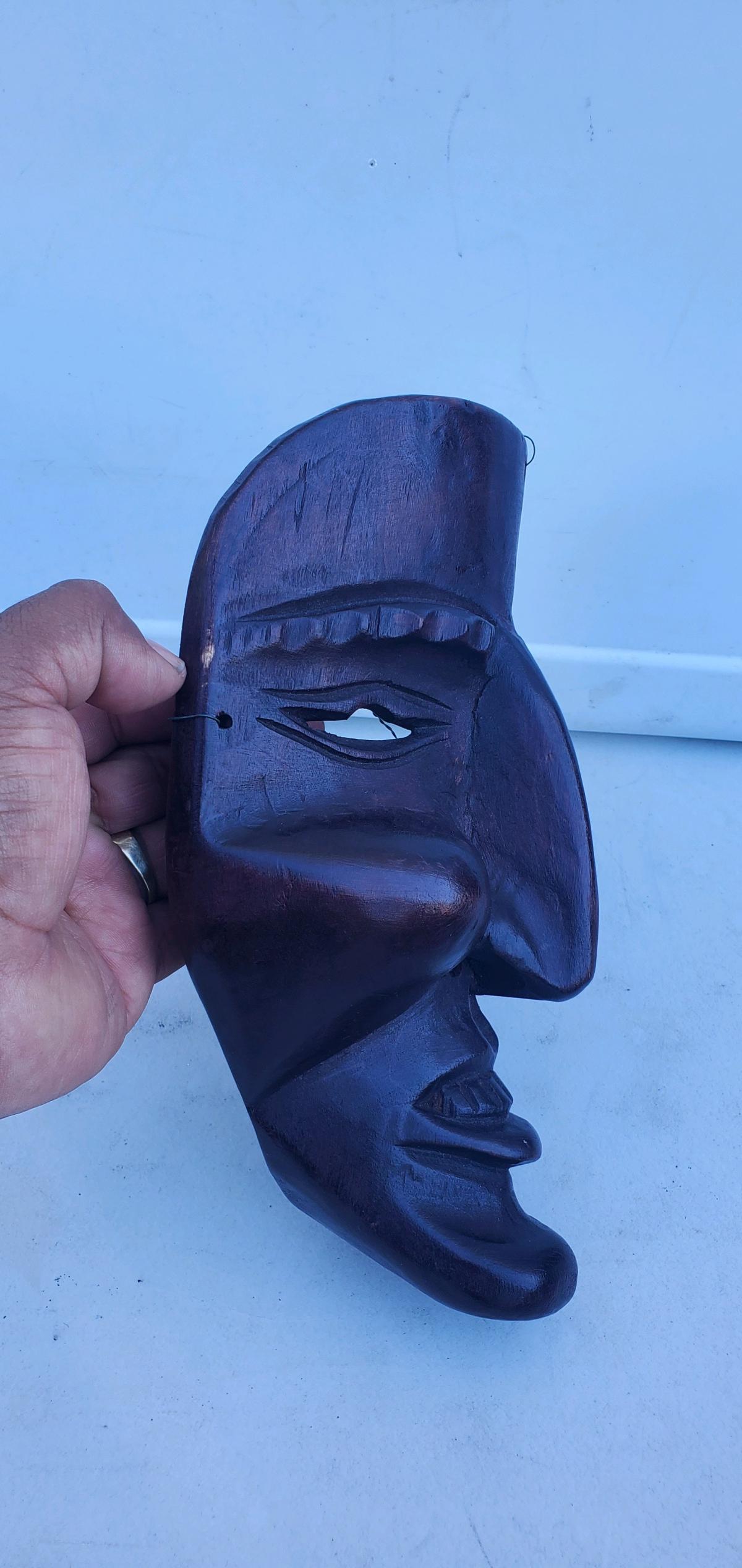 This is a  handcarved dark wood tribal or folk art