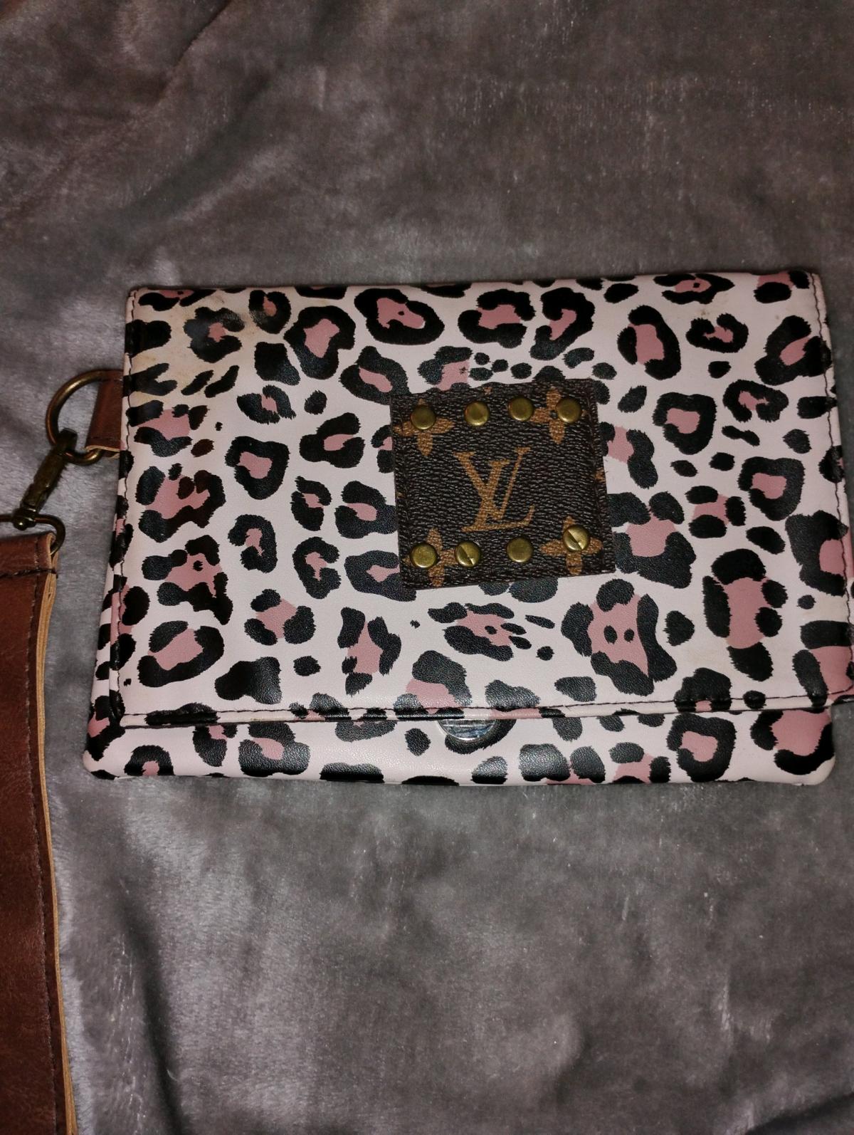 Louis Vuitton leopard print wristlet clutch