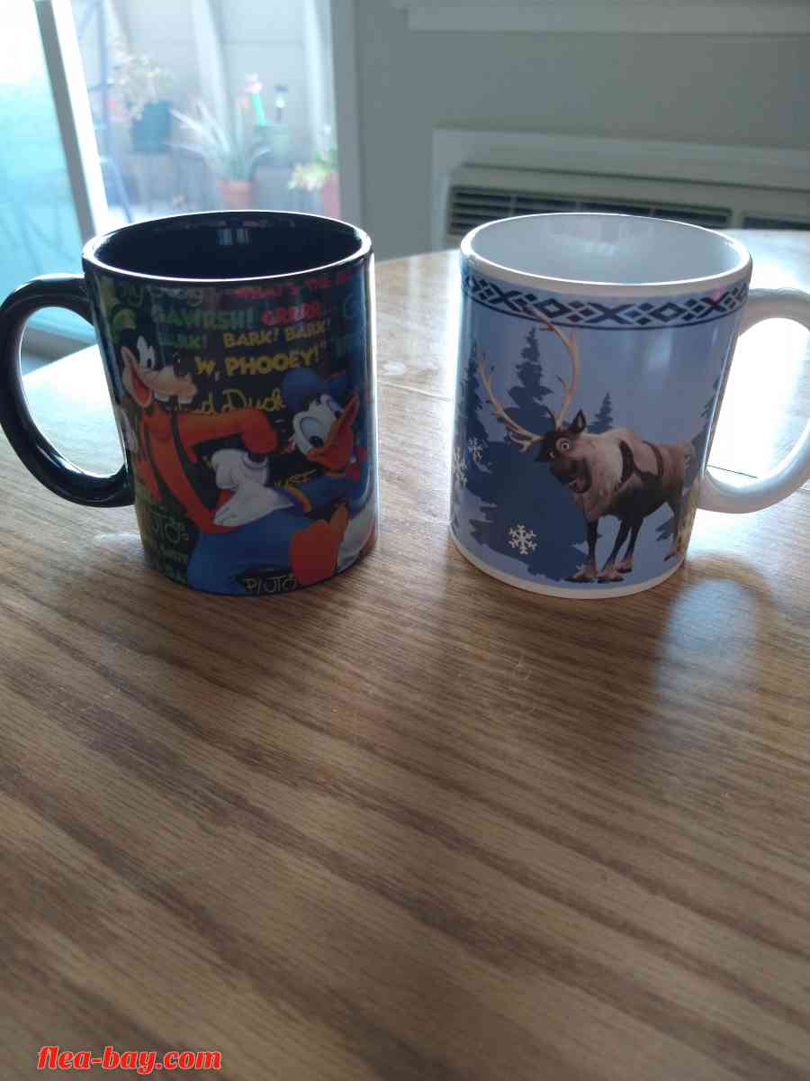 two Disney coffee cups