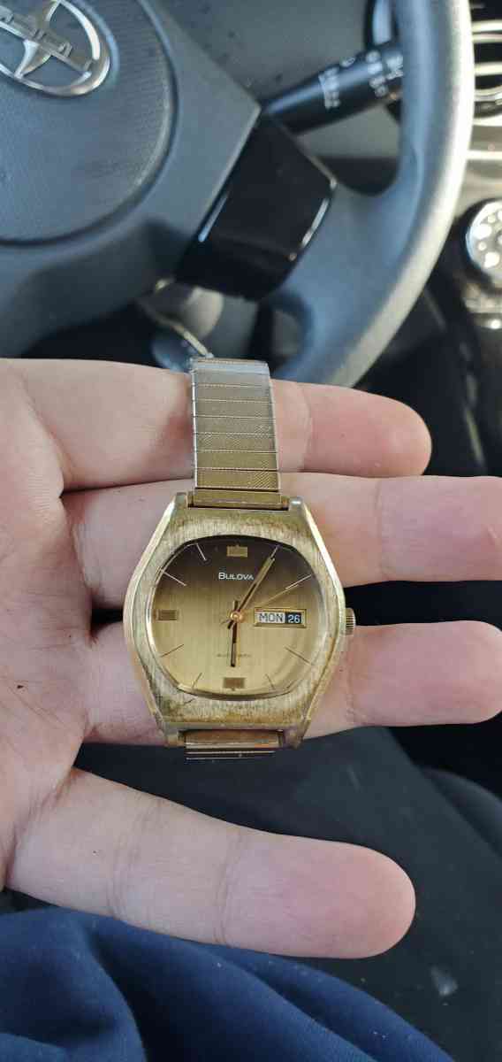 Gold Bulova watch
