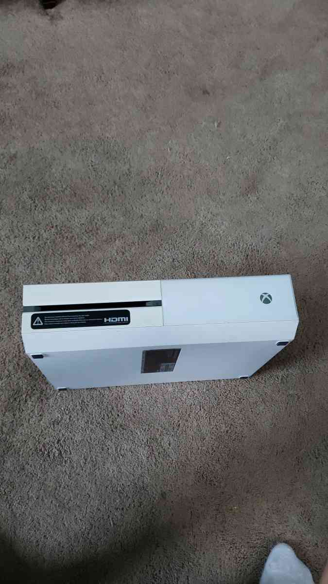 Xbox one with a wired controller and 3 games for the console