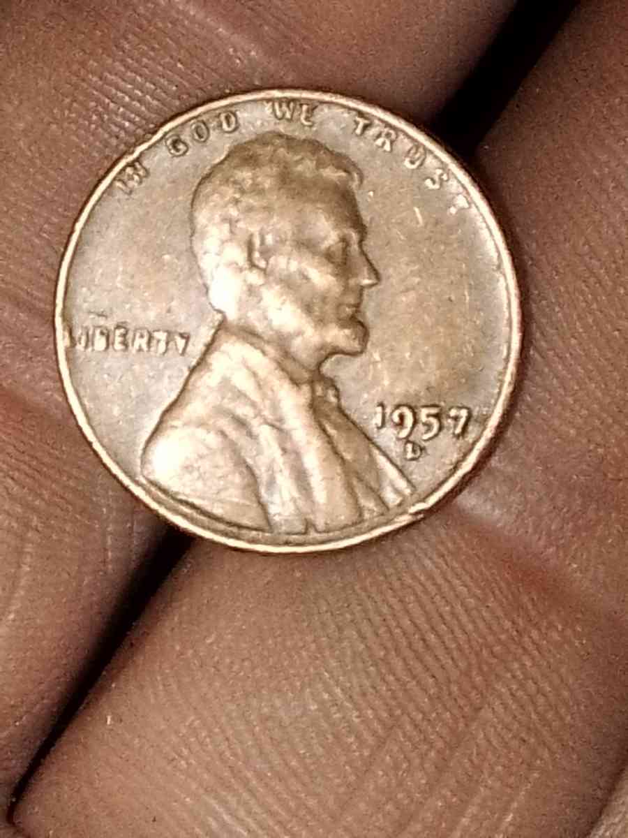 1957 d wheat penny with obverse error on the b on liberty