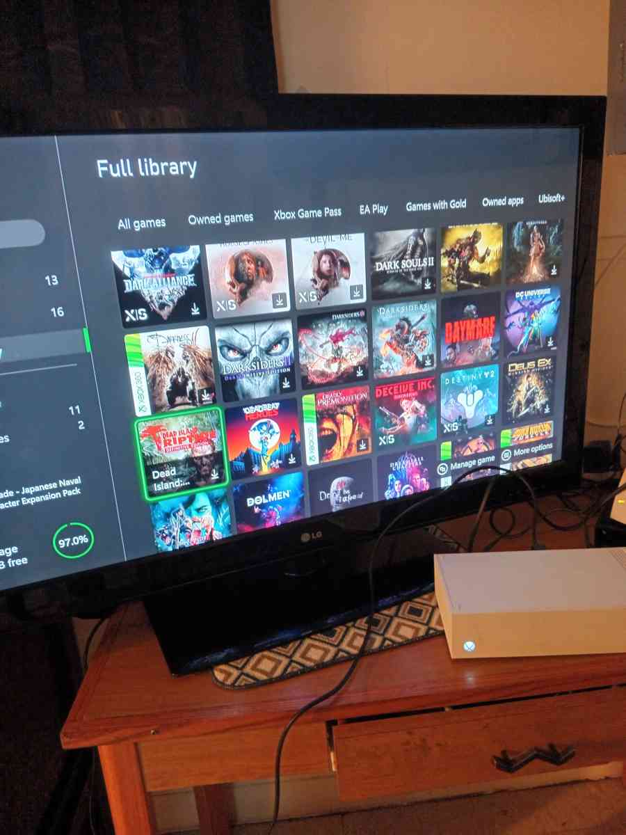 Xbox one with 300 games in it and 5 controllers