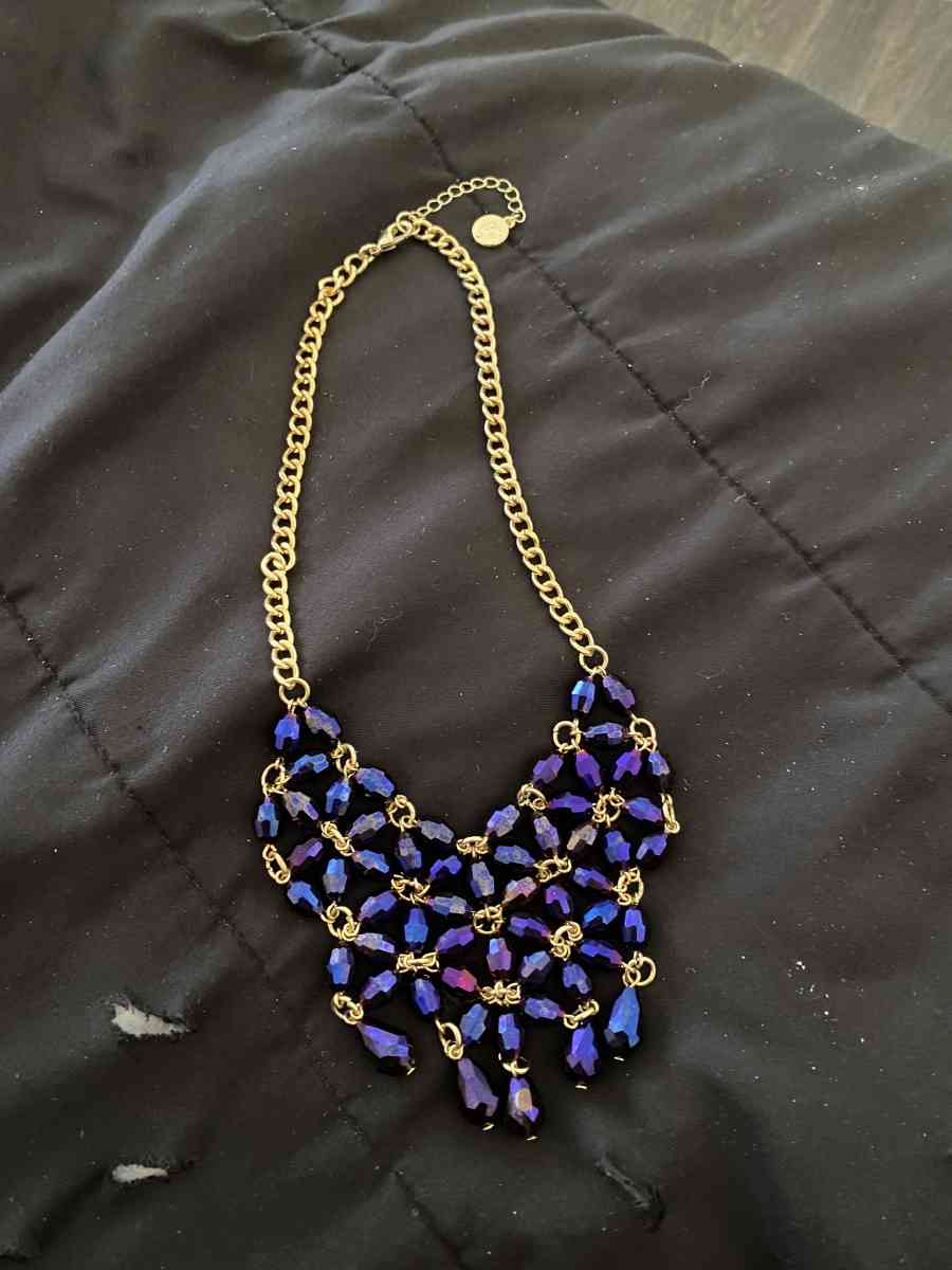a gold and Amethyst necklace